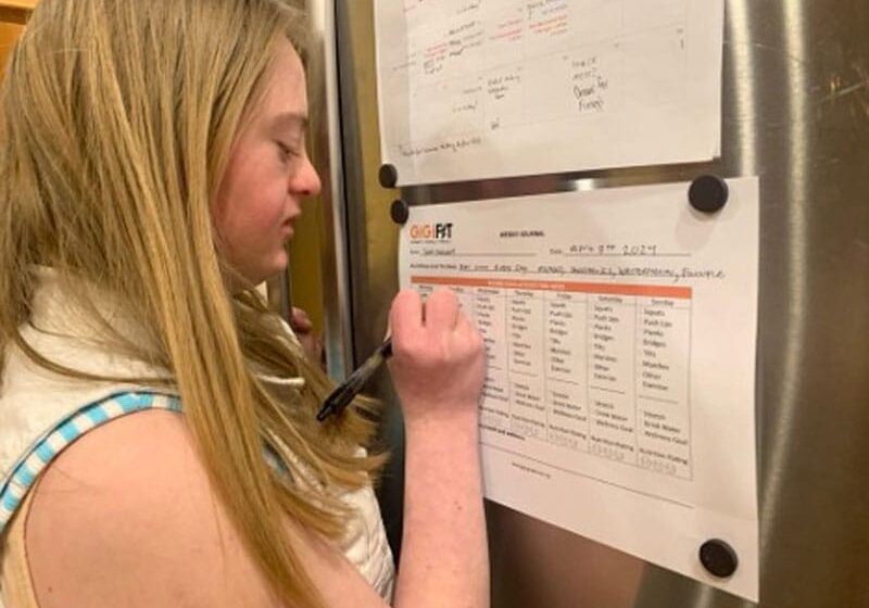 girl-filling-out-fitness-tracker